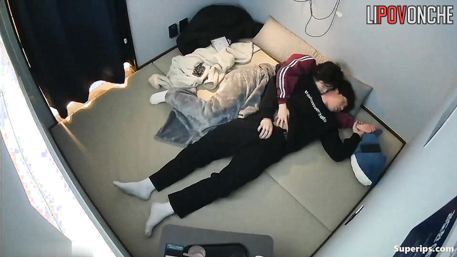 Young Korean couple satisfies each other while watching anime