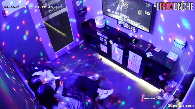Asian best friends singing in a cool karaoke club, hidden video