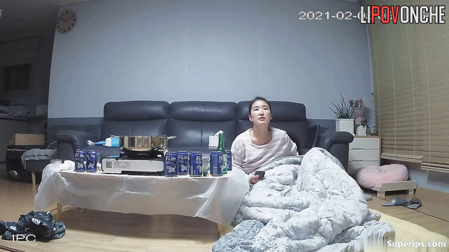 Asian couple enjoying tender love in authentic house