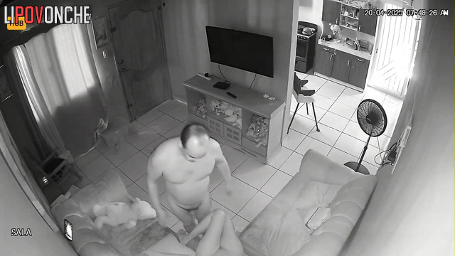 Bald and naked guy fucking his girl on a leather sofa
