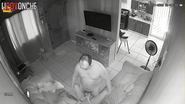 Bald and naked guy fucking his girl on a leather sofa