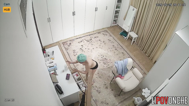 She smears her armpits and doesn't suspect that she is being watched