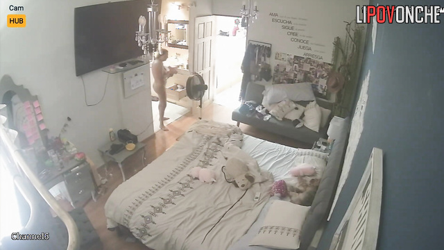 Slim girl drying her brown hair right now, hidden camera