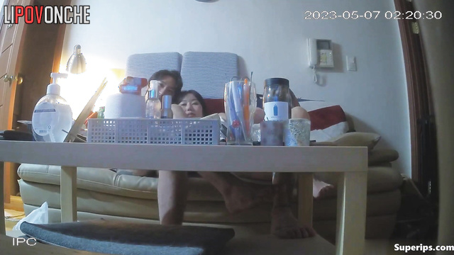 Asian tattooed couple smoking and eating at the same time