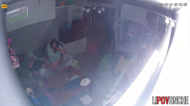 A tired husband watches football while wife jumps on his penis