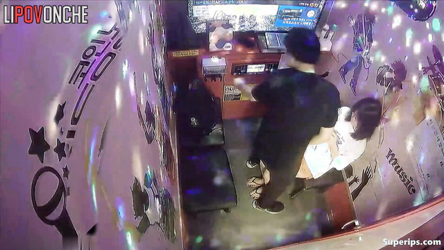 Sweet kisses and caresses in a karaoke club (asian couple)