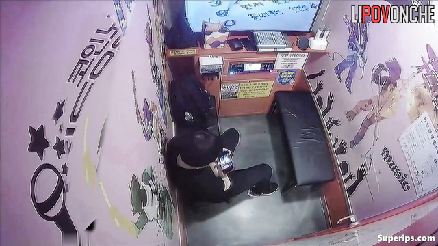 Sweet kisses and caresses in a karaoke club (asian couple)