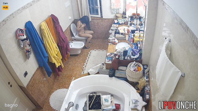 She is not embarrassed by her friend's presence in the toilet