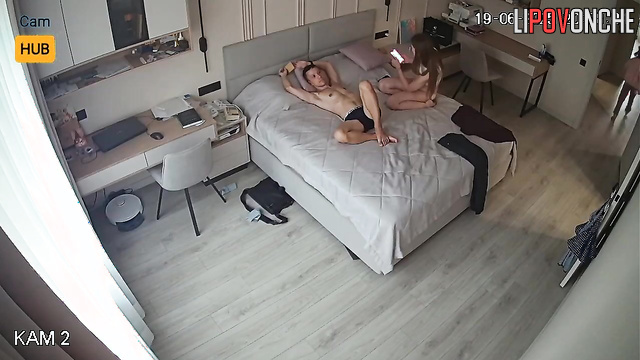 Slim & young couple chatting on bed (and her sister interrupted them)