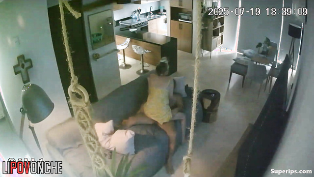 A sly blonde plays with her boyfriend's penis under his shorts