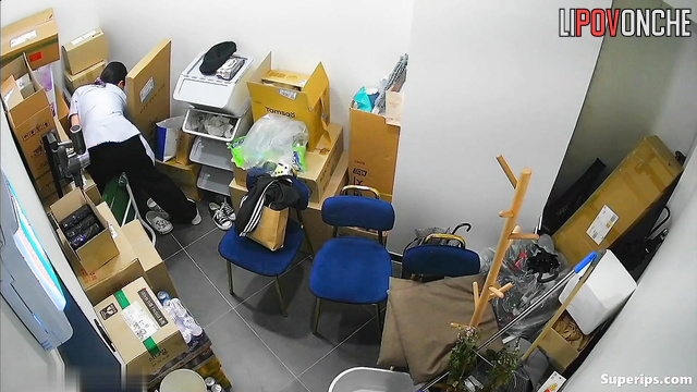 Young Korean women change into uniforms in a small office room