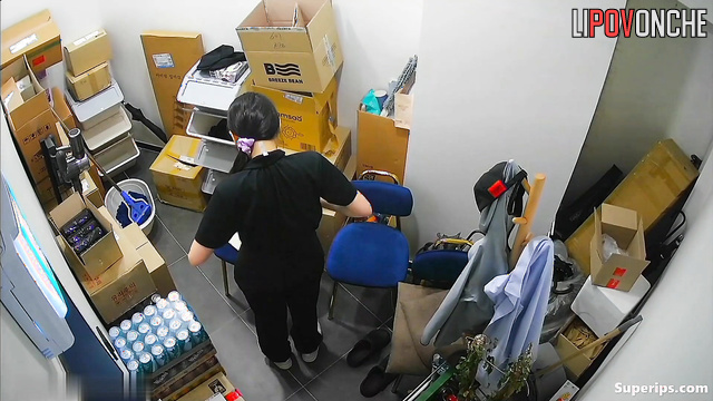 Young Korean women change into uniforms in a small office room