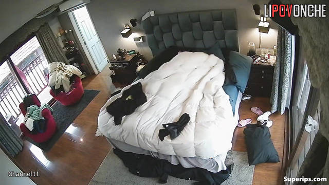 People fooling around in bedroom, unaware their passion is being filmed