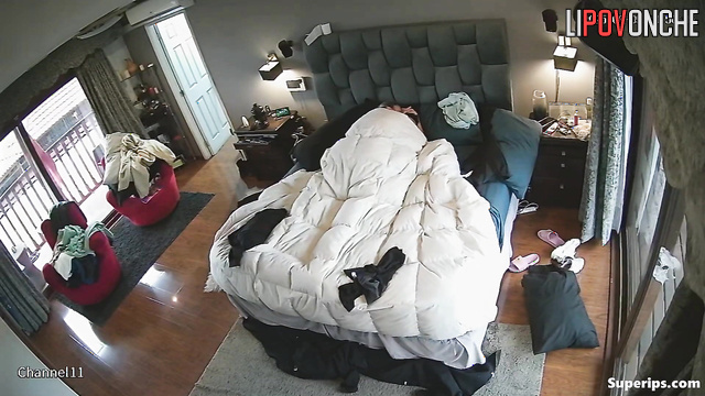 People fooling around in bedroom, unaware their passion is being filmed