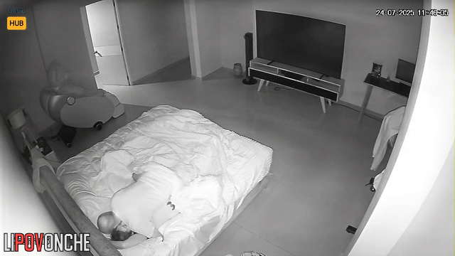Adults fucking in bed, unaware their joy is being filmed