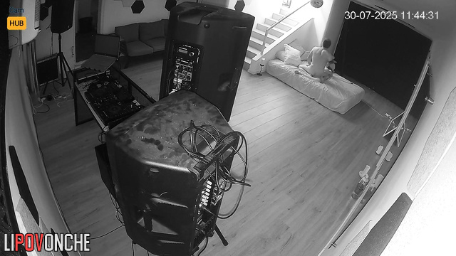 Lovers fucking in the living room, unaware their joy is being filmed