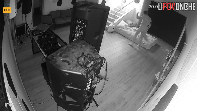 Lovers fucking in the living room, unaware their joy is being filmed