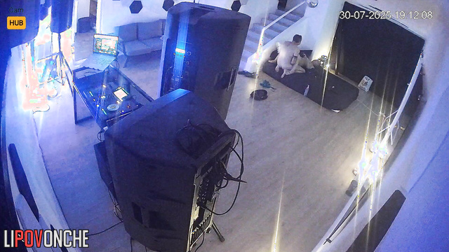 People kissing leisurely in the huge living room, look