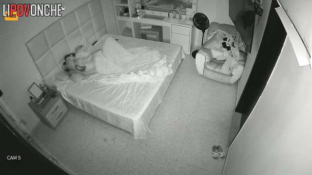 Young people rest together, blind to the secret surveillance (bedroom)