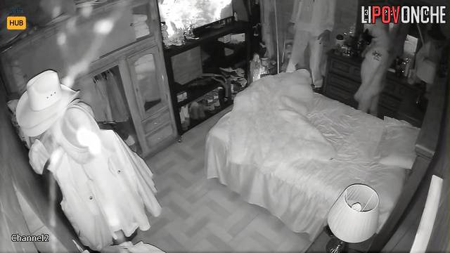 Spouses resting together, blind to the secret surveillance