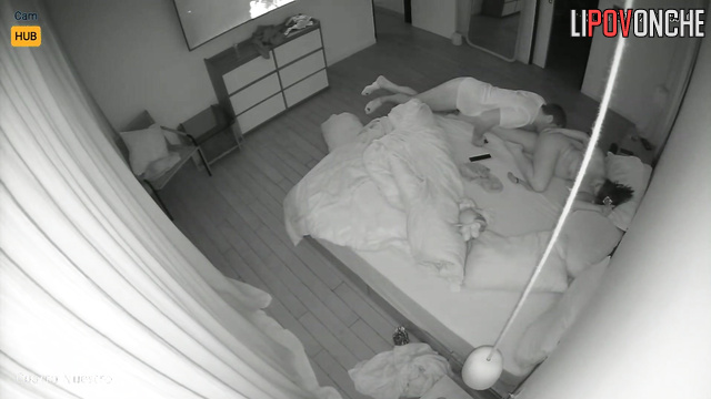 Lovers rest together, blind to the secret surveillance