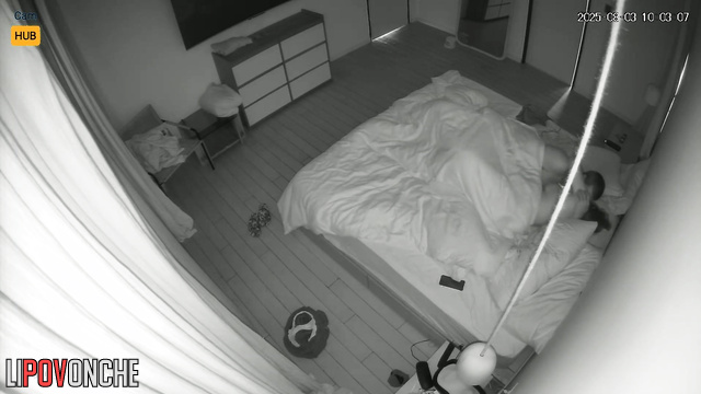 Couple kisses softly, not knowing a lens records their sex life