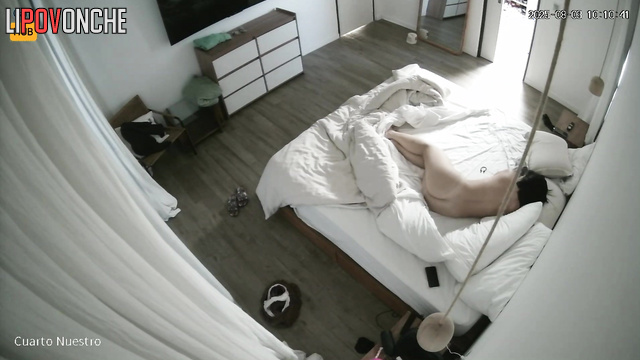 Couple kisses softly, not knowing a lens records their sex life