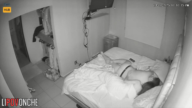 Lovers enjoying each other, blind to the hidden surveillance