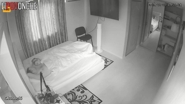 Russian couple relaxing together, not realizing neighbor observes them