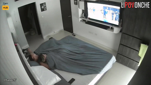 Naked people enjoying love unaware of the secret surveillance