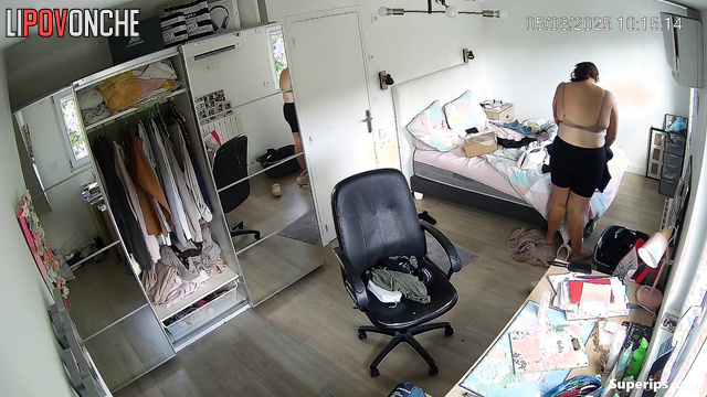 Lady dressing not paying attention to the watching device