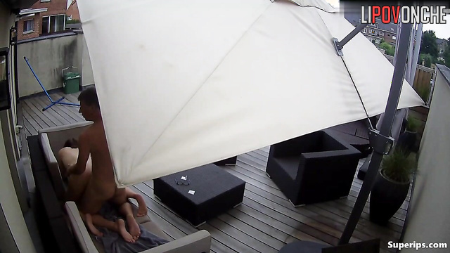 Husband and wife fooling around on a huge terrace