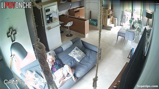 She talking flirtatiously on the phone and masturbating