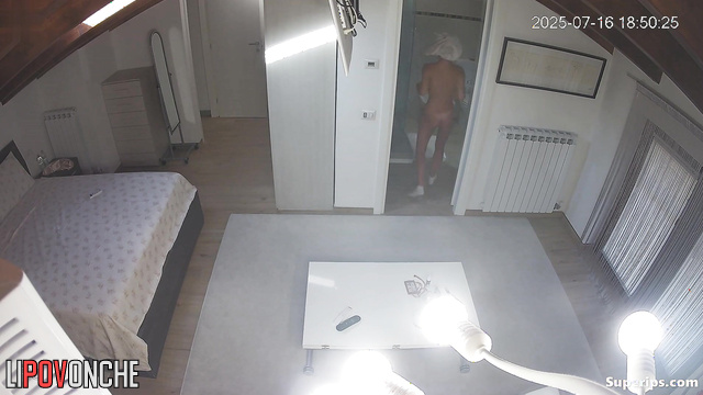 A young, skinny student walks around her bedroom completely naked