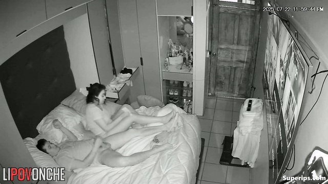A married couple watches guests on cameras while having sex