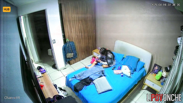 Couple gets dressed and unaware there is a tiny cam installed above the door