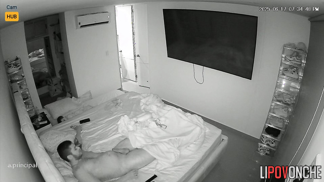 While her bored husband watches a movie,  Colombian wife licks his cock