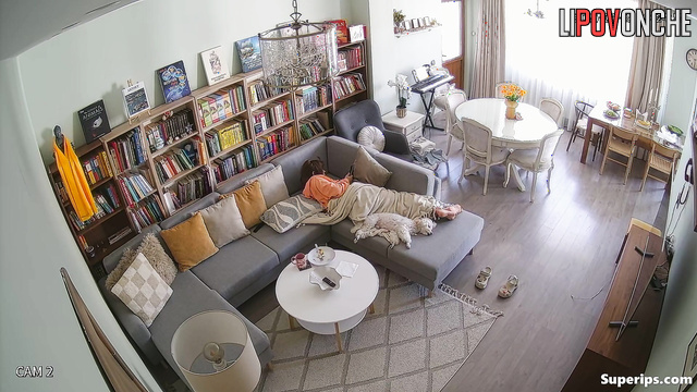 Young lady masturbating in a cozy living room, look
