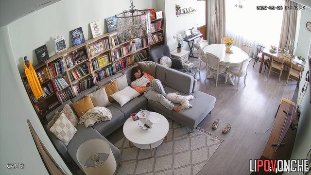 Young lady masturbating in a cozy living room, look
