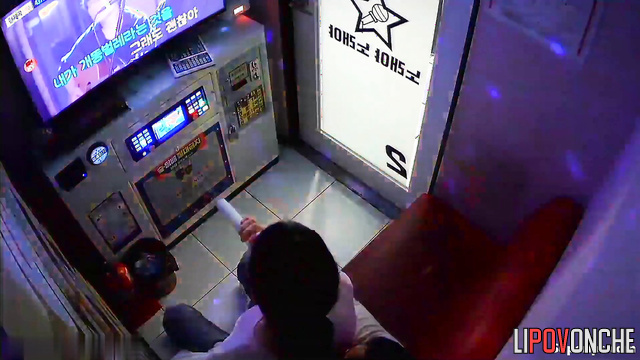 Asian couple kissing in the karaoke club / public tape
