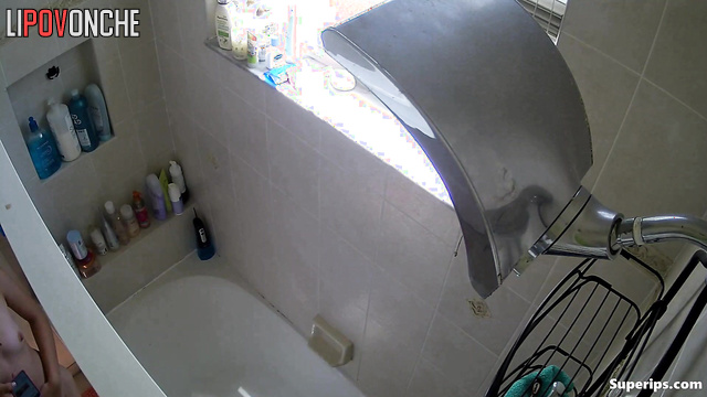 Naked babe taking a shower, not sensing unseen eyes on her