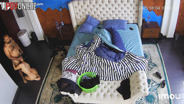 Couple enjoying interracial love in the cozy bedroom