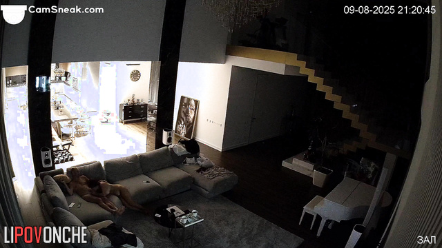 Lovers rested in the living room while a stranger watched them