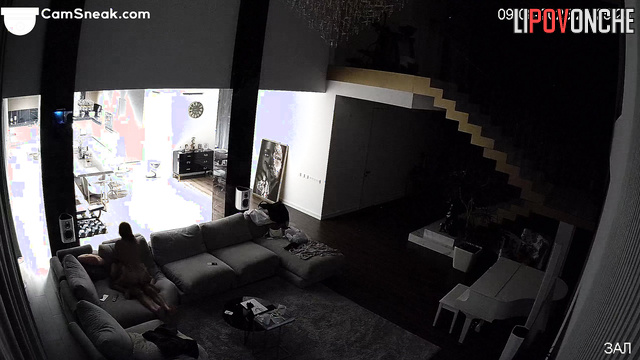 Lovers rested in the living room while a stranger watched them
