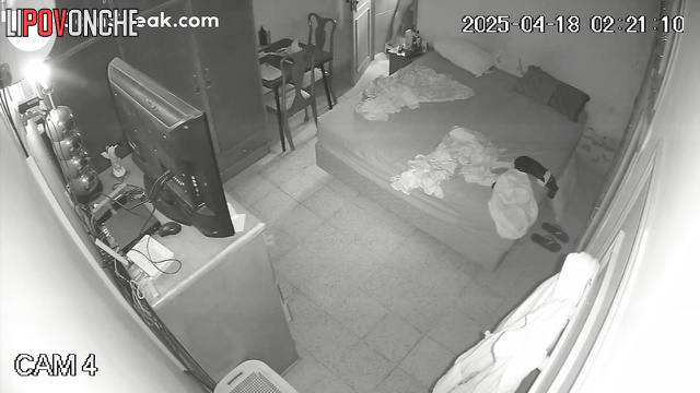 Naked lovers rested in the bed while a stranger watched over them
