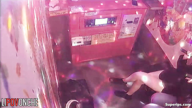Teens enjoying kisses after school (karaoke club)