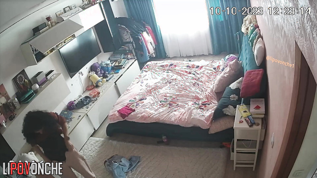 Curly brunette changing clothes alone (hidden video)