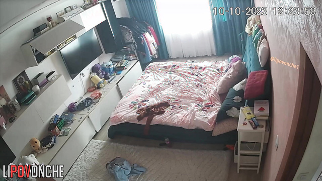 Curly brunette changing clothes alone (hidden video)