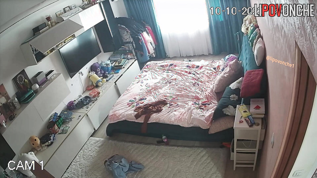 Curly brunette changing clothes alone (hidden video)