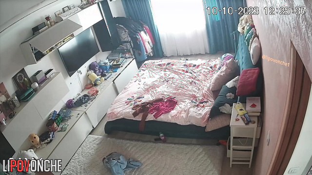 Curly brunette changing clothes alone (hidden video)
